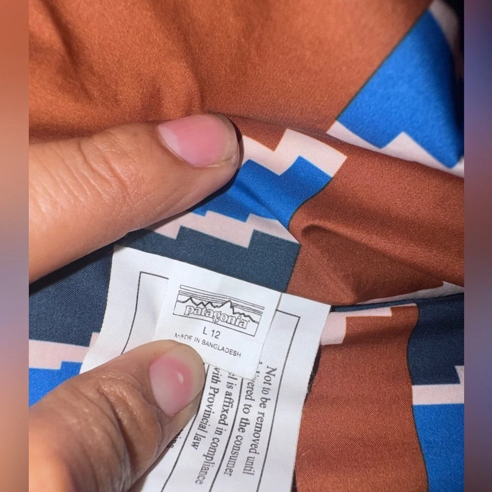 Patagonia Blue and Brown Puffer Jacket with Geometric Design
